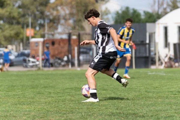 soccer player running with ball